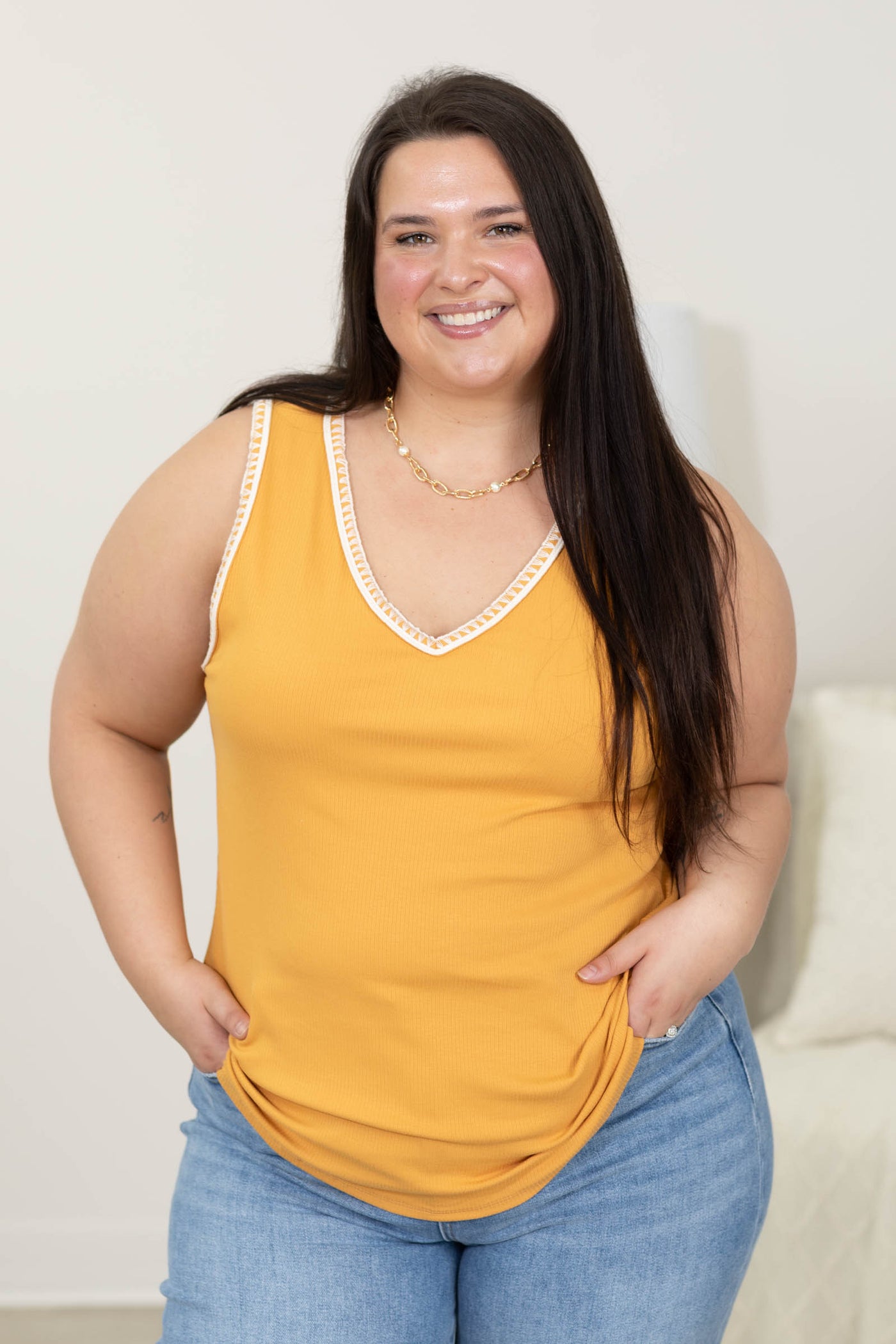 Sleeveless Top with V-Neck and Trim Detail