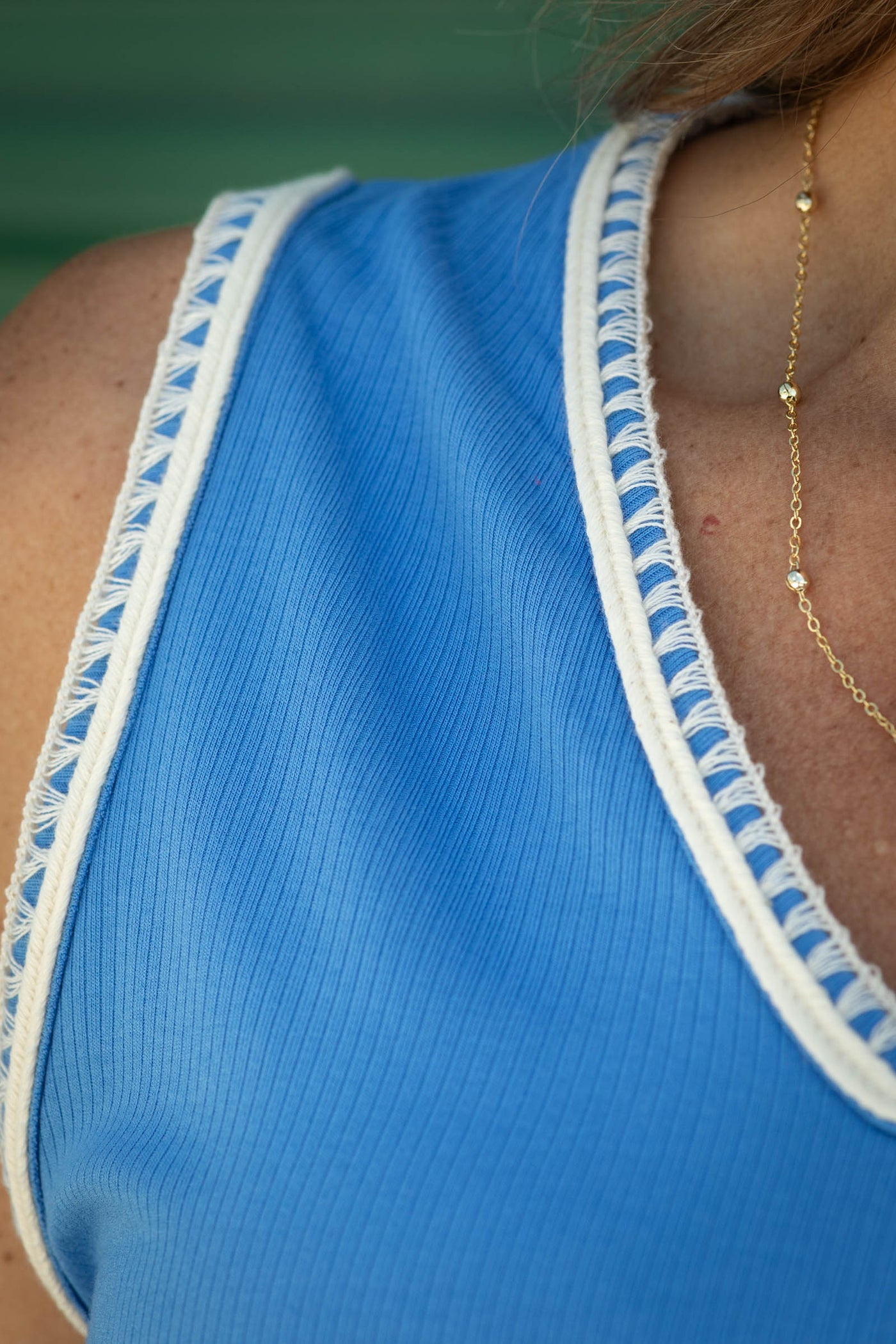 Sleeveless Top with V-Neck and Trim Detail