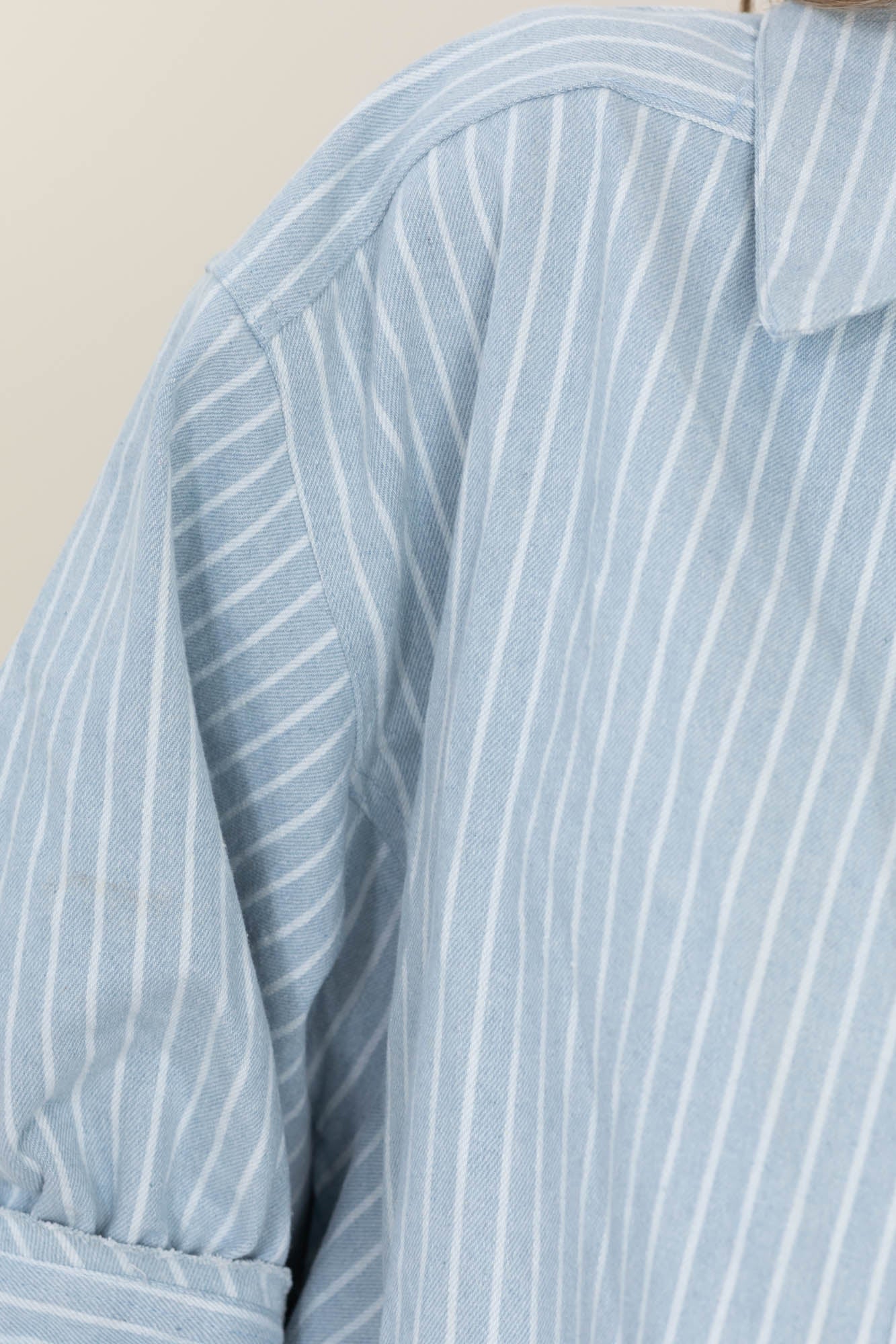 Light Denim Stripe Ruffled Hem Button Up Top