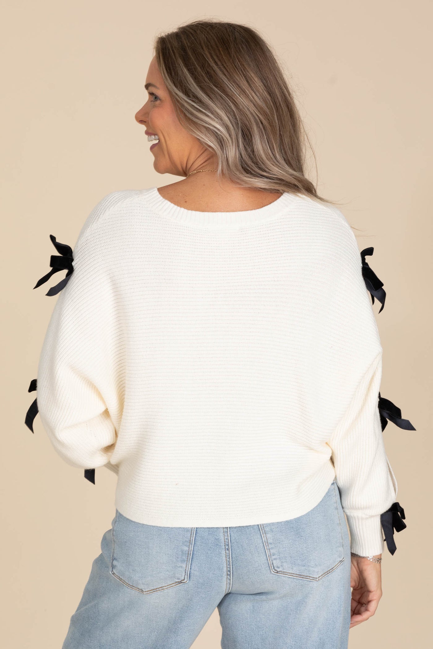Ivory Knit Sweater With Tie Bows On Sleeves