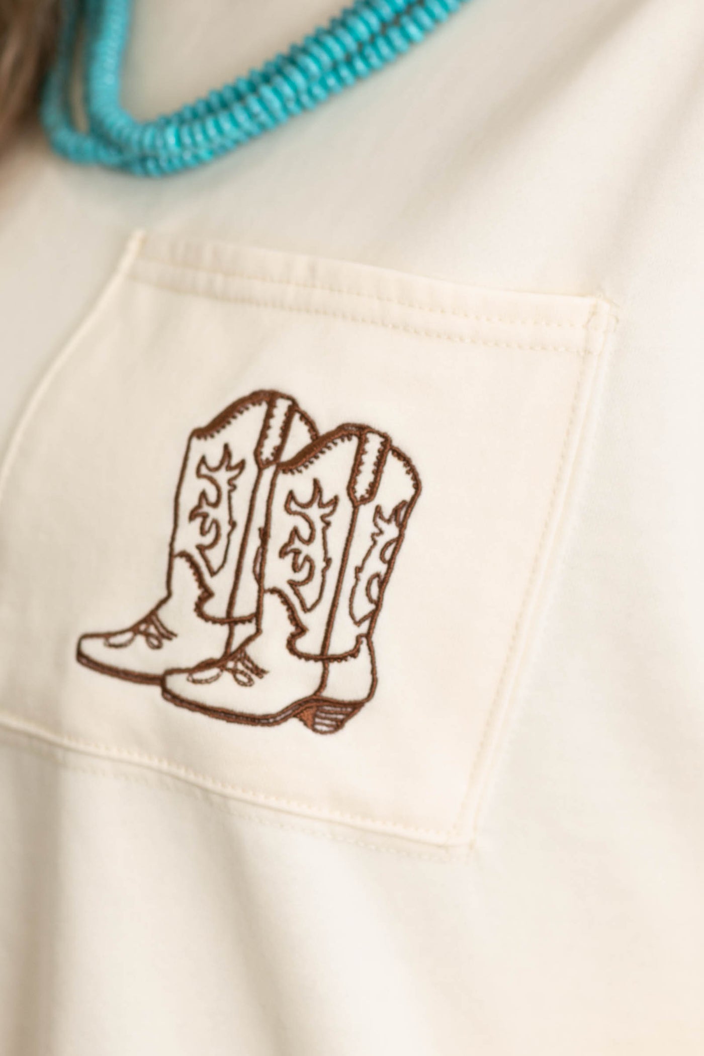 Cream Knit Top With Boot Embroidered Pocket