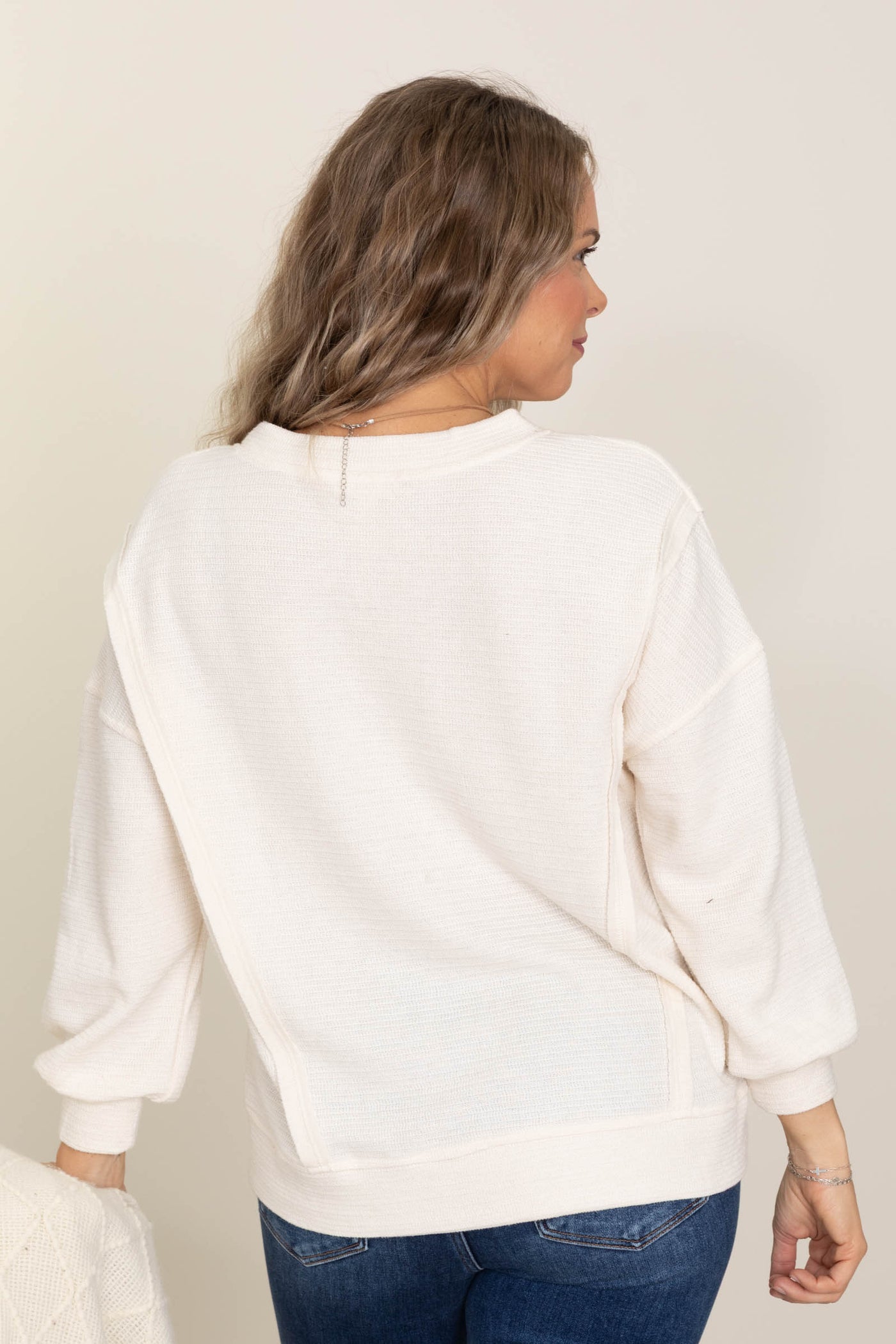 Ivory Split Neck Exposed Seam Knit Top